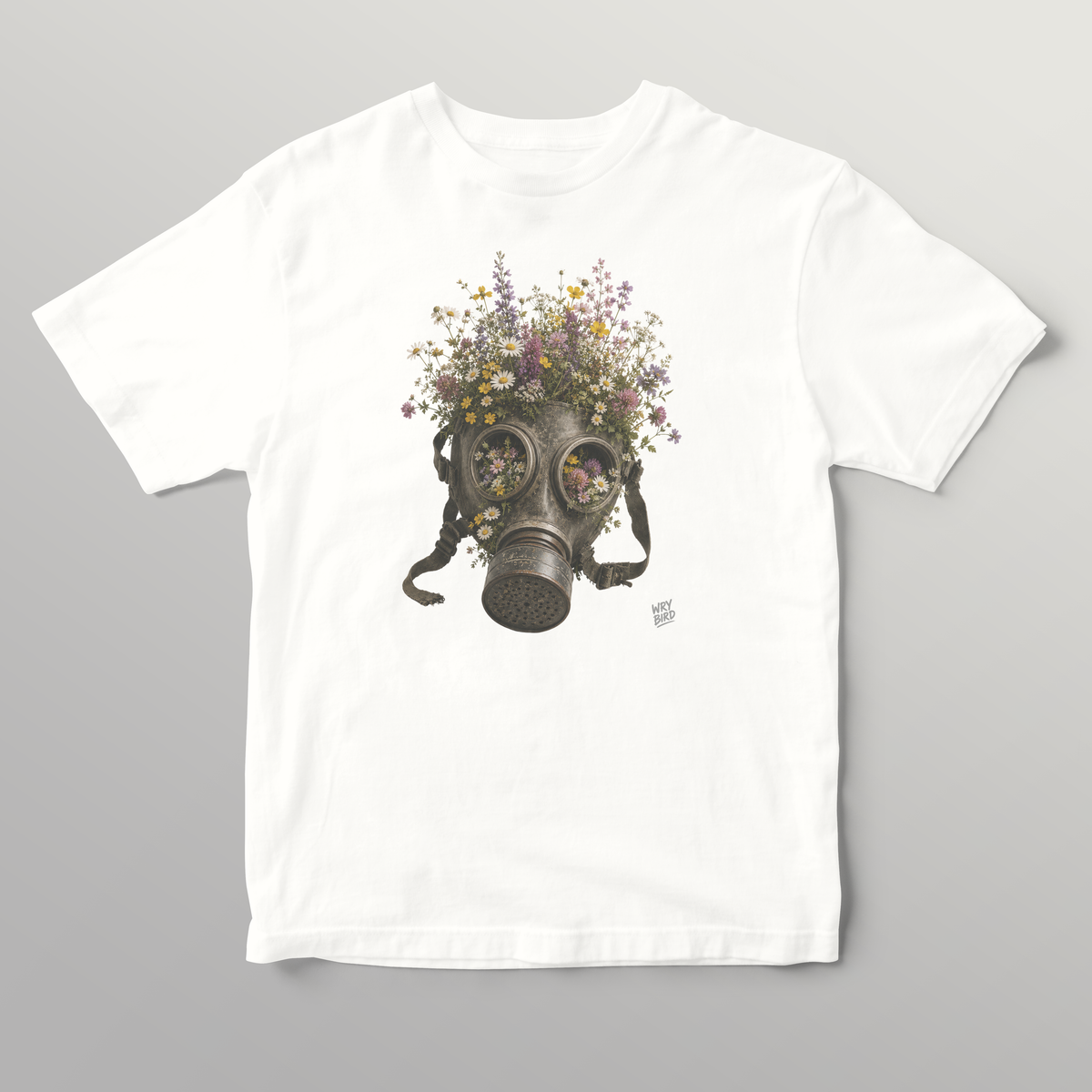 A white short-sleeve crewneck t-shirt featuring an anti-war Wry Bird graphic print of a vintage gas mask filled with colorful wildflowers, displayed against a neutral gray background.