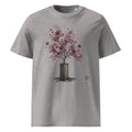 A heather gray Wry Bird short-sleeve crewneck t-shirt featuring a graphic print of a tree with colorful pink, purple, and white blossoms growing out of a dark barrel, shown against a plain white background.