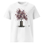 A white short-sleeve crewneck t-shirt featuring a graphic print of a tree with purple and pink flower-like foliage growing out of a dark barrel, with a small Wry Bird logo on the lower right of the graphic.